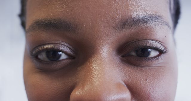 Portrait of happy eyes of african american female patient in hospital room. Medical services, healthcare and medicine, unaltered.