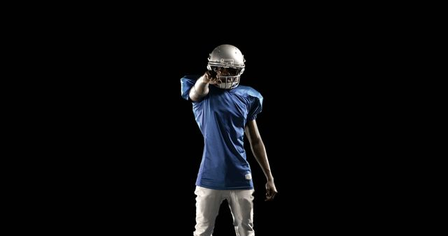 American Football Player Pointing Forward Against Black Background - Download Free Stock Images Pikwizard.com