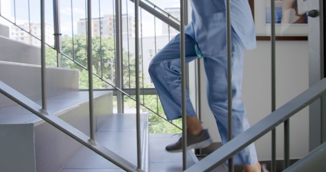 Healthcare Professional Climbing Stairs in Hospital Environment - Download Free Stock Images Pikwizard.com