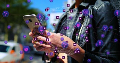 Caucasian woman exploring digital networks on smartphone