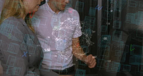 Engineers Analyzing Advanced Network in Server Room