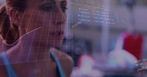 Woman Analyzing Fitness Data Overlay in Gym Using Wearable Metrics for Training Focus