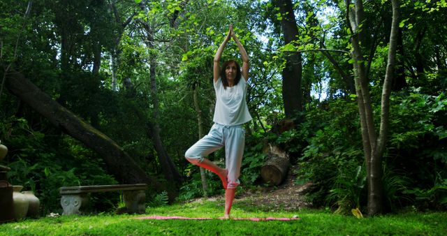 Woman Practicing Yoga in Serene Forest Setting - Download Free Stock Images Pikwizard.com