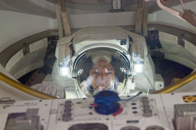 ISS028-E-005376 (25 May 2011) --- NASA astronaut Andrew Feustel, STS-134 mission specialist, attired in an Extravehicular Mobility Unit (EMU) spacesuit, enters the Quest airlock of the International Space Station as the mission?s third session of extravehicular activity (EVA) draws to a close.