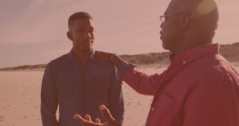 Father Teaching Son on Beach in Warm Evening Light - Download Free Stock Images Pikwizard.com