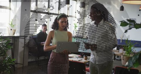 Business Collaboration in High-Tech Office with Data Overlay