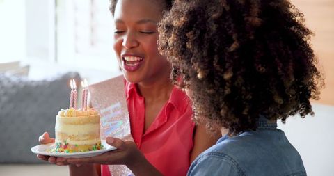 Woman Celebrating Birthday with Friends at Home Gathering