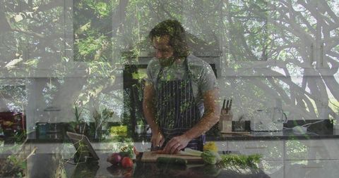 Man Preparing Vegetables in Modern Kitchen with Nature Overlap