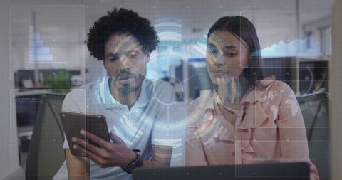 Colleagues Collaborating in Modern Office with Digital Interface Display