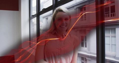 Contemporary Woman Near Window with Dynamic Light Trails