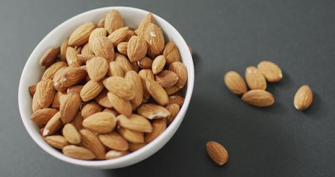 Fresh Almonds in White Bowl on Grey Background - Download Free Stock Images Pikwizard.com