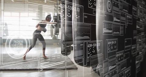 Athletic Woman Combining Workout and Advanced Fitness Technology