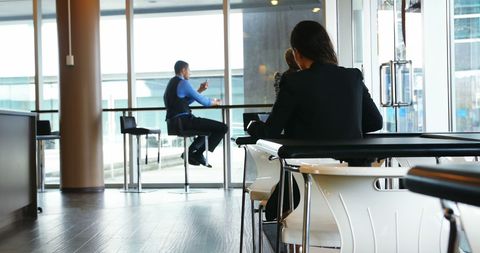 Businesswoman Seated at Office Cafeteria Table - Download Free Stock Images Pikwizard.com