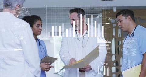 Multidisciplinary medical team reviewing patient records and clinical data in hospital hallway