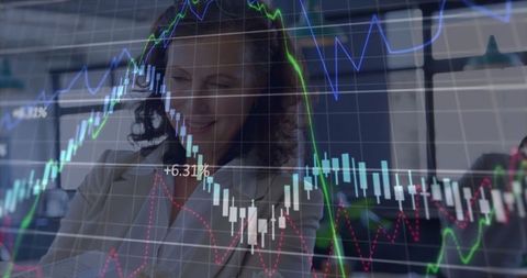 Businesswoman Analyzing Financial Charts for Strategic Planning