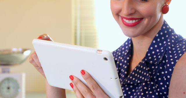 Woman Engaging with Digital Tablet Wearing Polka Dot Dress - Download Free Stock Images Pikwizard.com