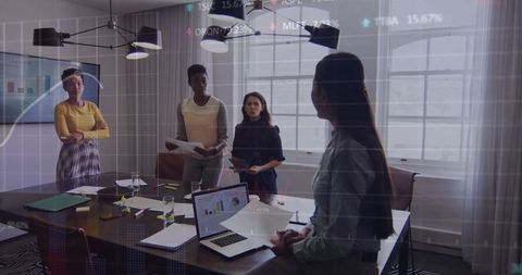 Diverse Business Team Collaborating with Finance Data in Meeting