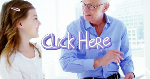 Grandfather with Granddaughter Bonding with Tablet in Bright Room