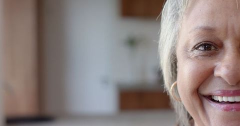 Senior Woman Happy at Home, Elegance and Warmth in Minimalist Space