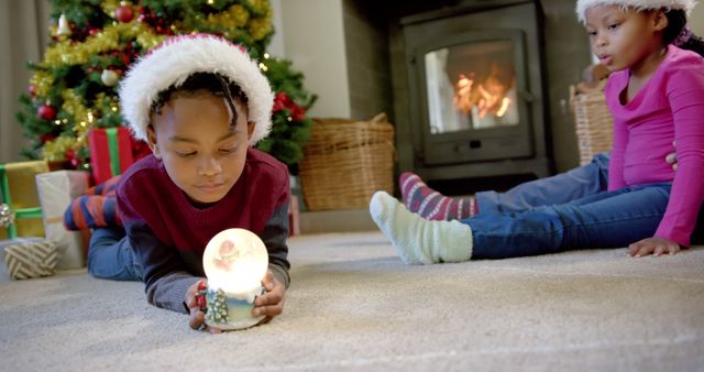 Children Enjoying Christmas by Fireplace with Decorations - Download Free Stock Images Pikwizard.com