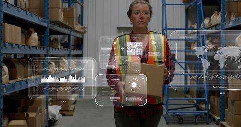 Warehouse Worker Handling Inventory with Digital Interface Overlays - Download Free Stock Images Pikwizard.com