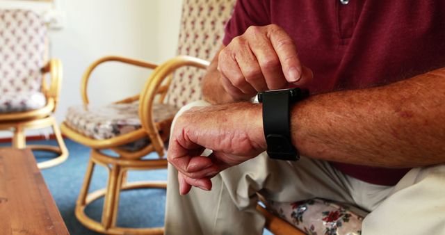 Senior Man Using Smartwatch Indoors - Download Free Stock Images Pikwizard.com