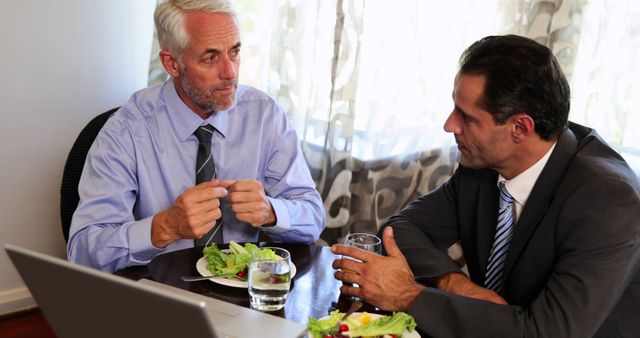 Two Businessmen Having Lunch at Office Meeting - Download Free Stock Images Pikwizard.com