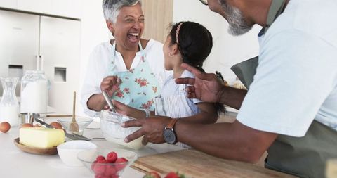 Multigenerational Family Bonding While Baking in Sunlit Kitchen