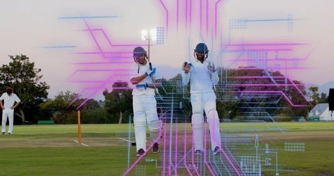 Cricket batsmen pointing on pitch at twilight with neon magenta and blue data overlay