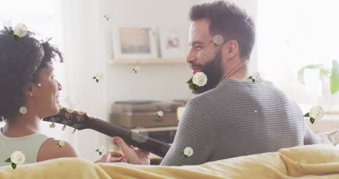 Interracial Couple Enjoying Guitar Moment with Floral Animation