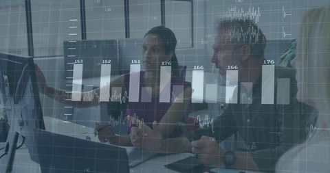 Colleagues Analyzing Financial Data on Office Monitor - Download Free Stock Images Pikwizard.com