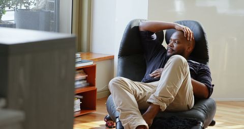 Relaxed Man Enjoying Downtime in Modern Home Interior - Download Free Stock Images Pikwizard.com