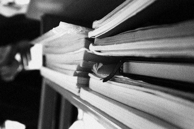 Stack of Books and Papers in Black and White - Download Free Stock Photos Pikwizard.com