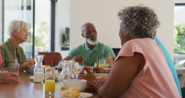 Happy senior diverse people having breakfast at retirement home - Download Free Stock Photos Pikwizard.com