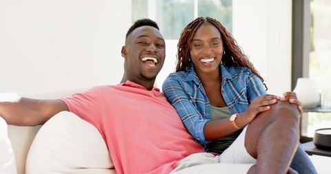 Joyful African American Couple Relaxing at Home Together
