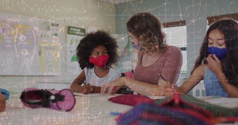 Teacher and children wearing masks learning mathematics in classroom