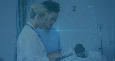 Healthcare Professionals Using Tablet in Hospital Room