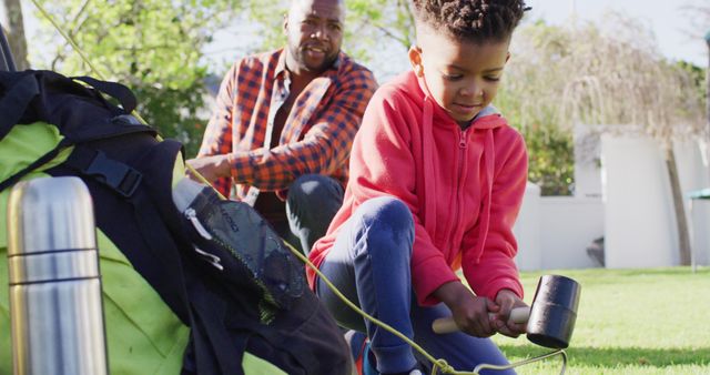 Father and Daughter Setting Up Tent for Camping Outdoors - Download Free Stock Images Pikwizard.com