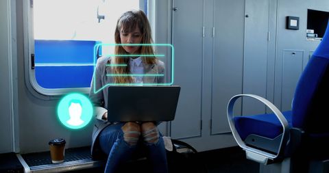 Woman Working on Laptop with Coffee in Train Journey