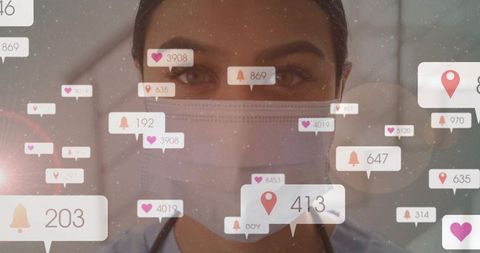 Masked Clinician Checking Digital Alerts and Patient Notifications on Healthcare Dashboard