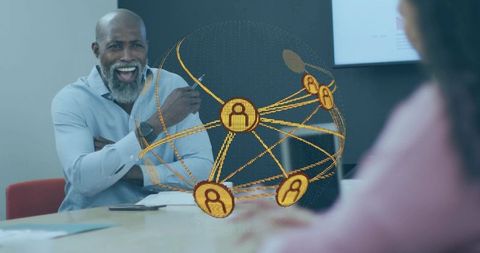 Smiling businessman leading collaborative meeting with glowing digital network globe overlay