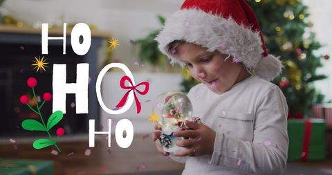 Child in Santa Hat Holding Snow Globe for Christmas Celebration