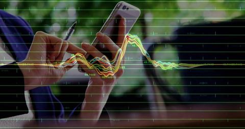 Professional woman analyzing data with smartphone and graph overlay