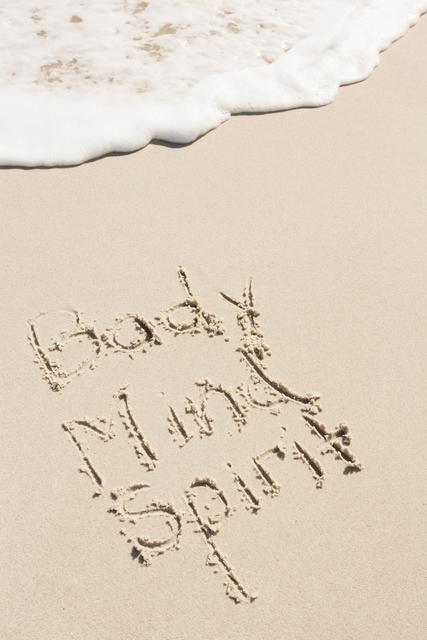 Body Mind Spirit Written in Sand on Beach - Download Free Stock Photos Pikwizard.com