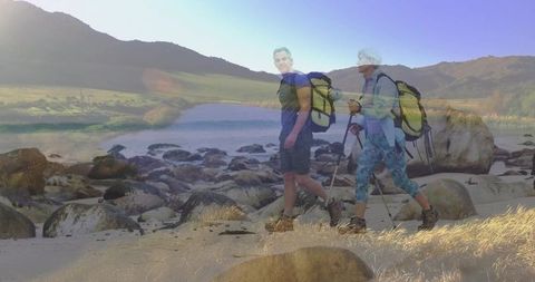 Active Senior Couple Hiking in Scenic Coastal Landscape