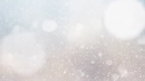 Dreamy drifting snowflakes falling over soft bokeh field gentle winter snowfall cinematic loop