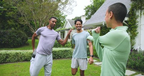 Diverse Friends Enjoy Outdoor Fitness Session in Front Yard