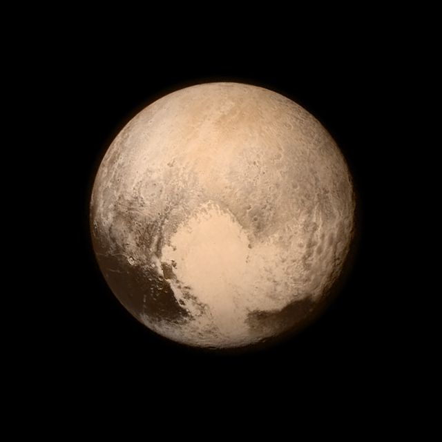 This high-resolution image of Pluto shows its large, heart-shaped feature captured by NASA's New Horizons spacecraft on July 13, 2015. The spacecraft was 476,000 miles away when this detailed view was taken. The bright 'heart' area stands out against darker equatorial regions and its mostly featureless interior may indicate geological activity. This image can be used in scientific research, educational materials, space exploration articles, and astronomy presentations.