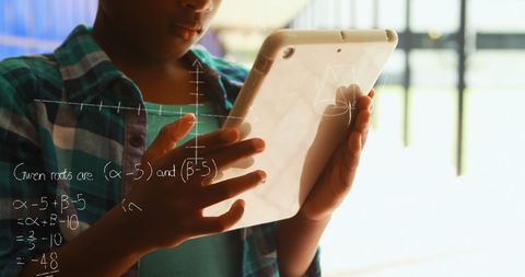 Schoolchild Engaging in Math Learning on Digital Tablet