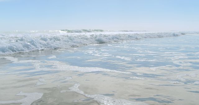 Calm Ocean Waves Gently Lapping Sandy Shoreline Under Clear Sky - Download Free Stock Images Pikwizard.com